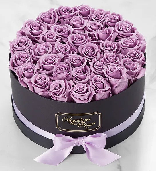 https://www.flowers.com/blog/wp content/uploads///womens day gifts with Magnificent Roses® Preserved Lavender Roses